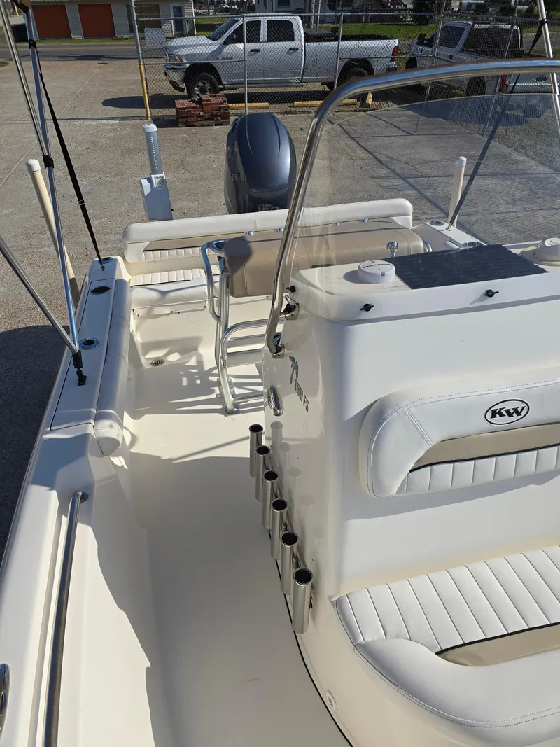 Slide: The Image of 2012 Key West 189 FS boat interior with seating and rod holders. - 12