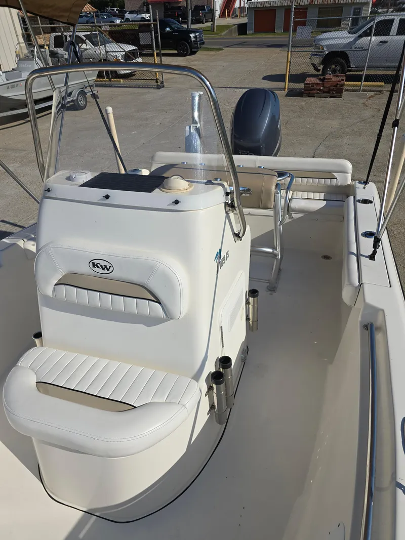 Slide: The Image of 2012 Key West 189 FS boat interior with seating and steering console. - 13
