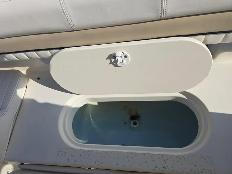 Slide: The Image of 2012 Key West 189 FS boat livewell with open lid, showcasing interior. - 17
