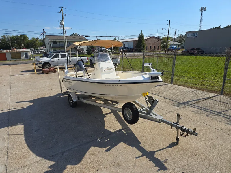 Slide: The Image of 2012 Key West 189 FS boat on trailer in sunny outdoor setting. - 2