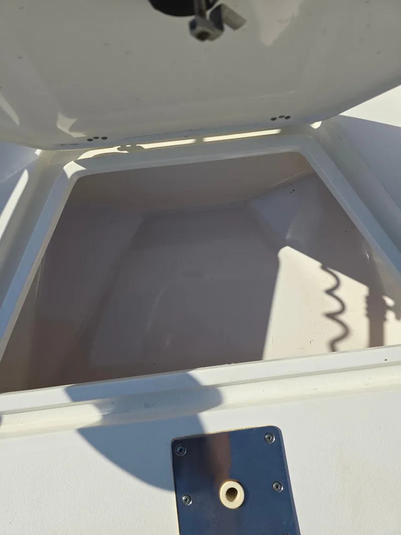 Slide: The Image of Open storage compartment on a 2012 Key West 189 FS boat. - 20