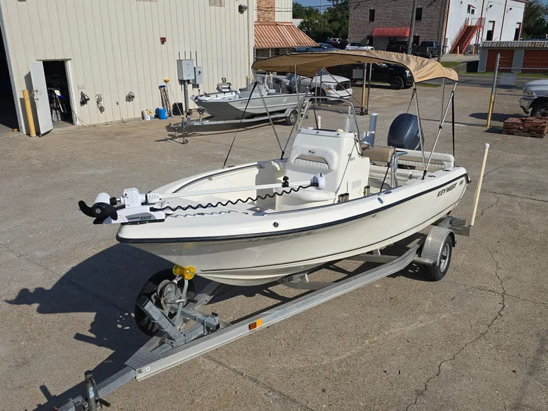 Slide: The Image of 2012 Key West 189 FS boat on trailer in a parking lot. - 5