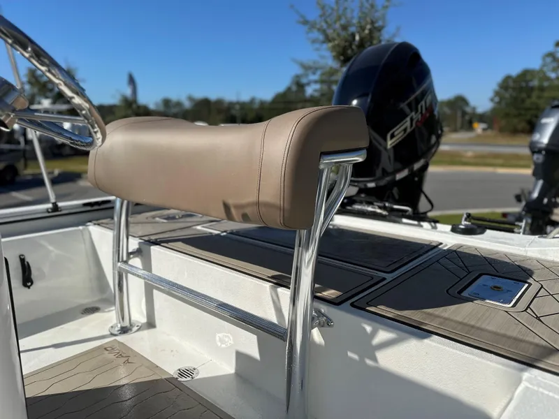Slide: The Image of Avid 18 Rogue 2025 boat interior with tan seating and sleek design. - 10