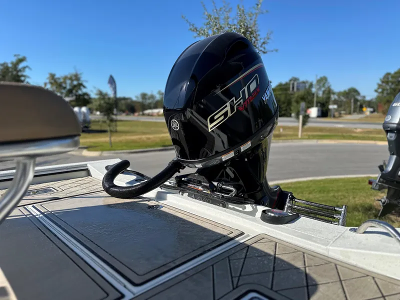 Slide: The Image of Avid 18 Rogue 2025 boat with Yamaha outboard motor on a sunny day. - 11