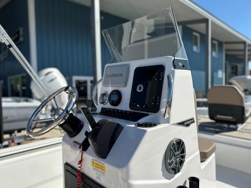Slide: The Image of 2025 Avid 18 Rogue boat console with Garmin navigation system. - 2