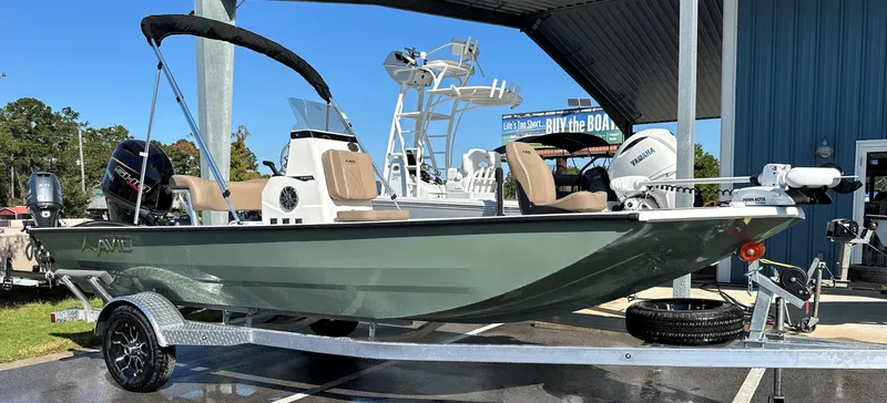 Slide: The Image of 2025 Avid 18 Rogue boat on trailer, parked outdoors under a canopy. - 6