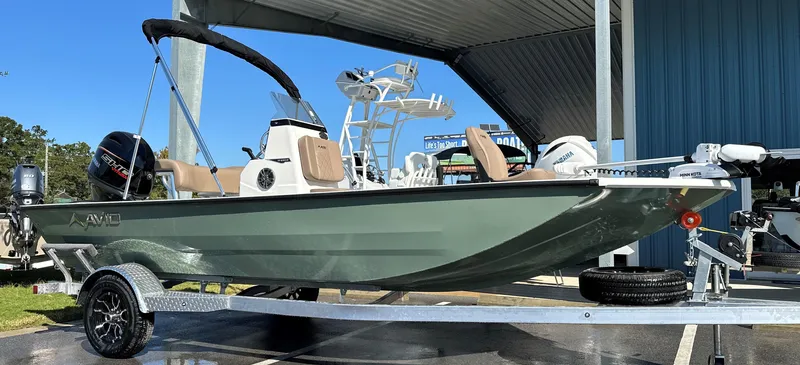 Slide: The Image of 2025 Avid 18 Rogue boat on trailer under canopy, side view. - 7