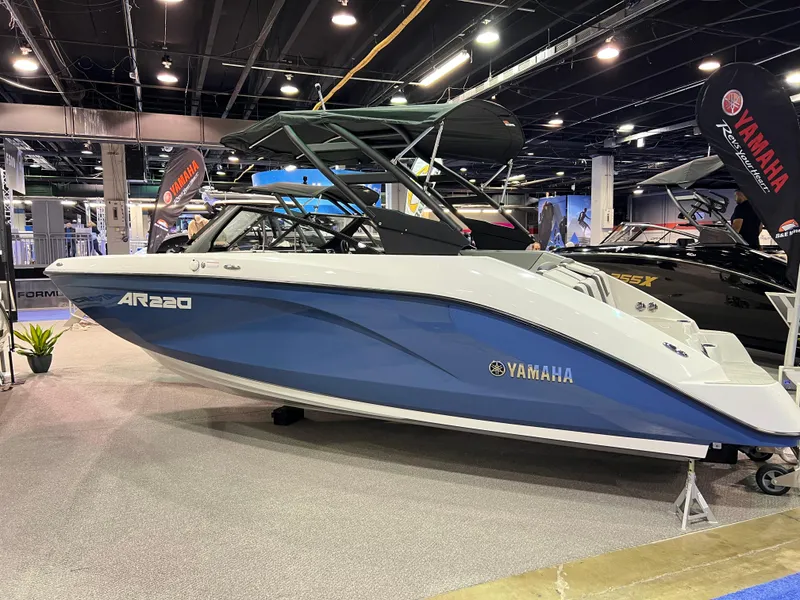 Slide: The Image of 2025 Yamaha AR220 boat displayed at an indoor exhibition. - 1