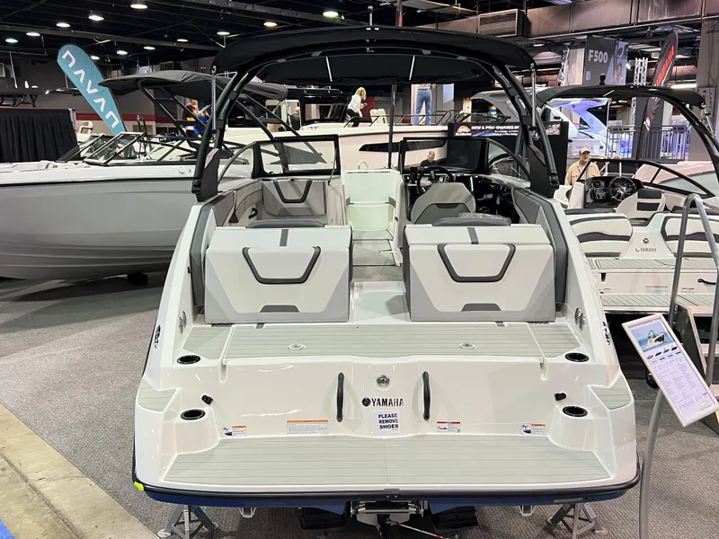 Slide: The Image of 2025 Yamaha Boats AR220 displayed at a boat show, showcasing sleek design and modern features. - 3