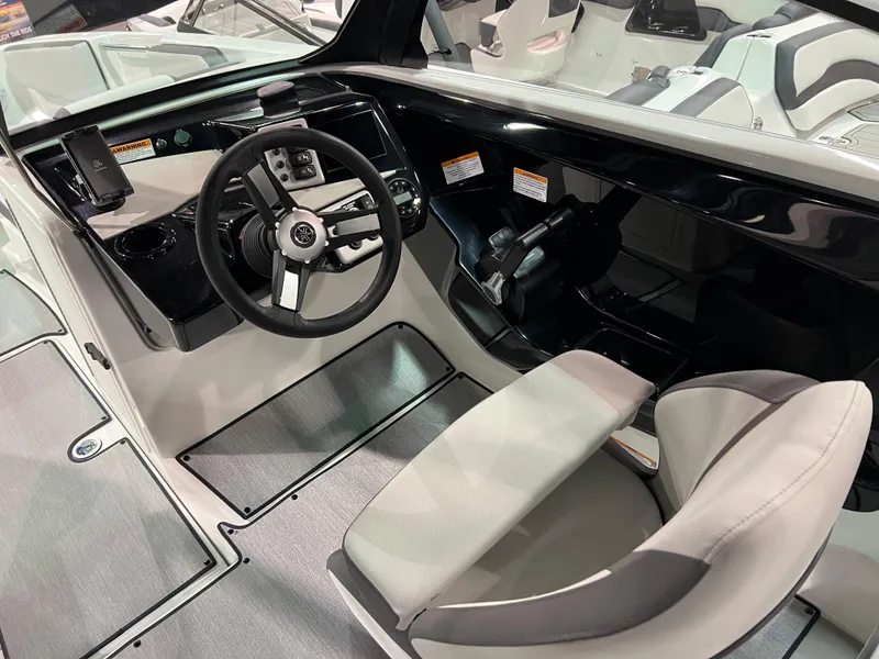 Slide: The Image of 2025 Yamaha Boats AR220 cockpit with modern steering and controls. - 4