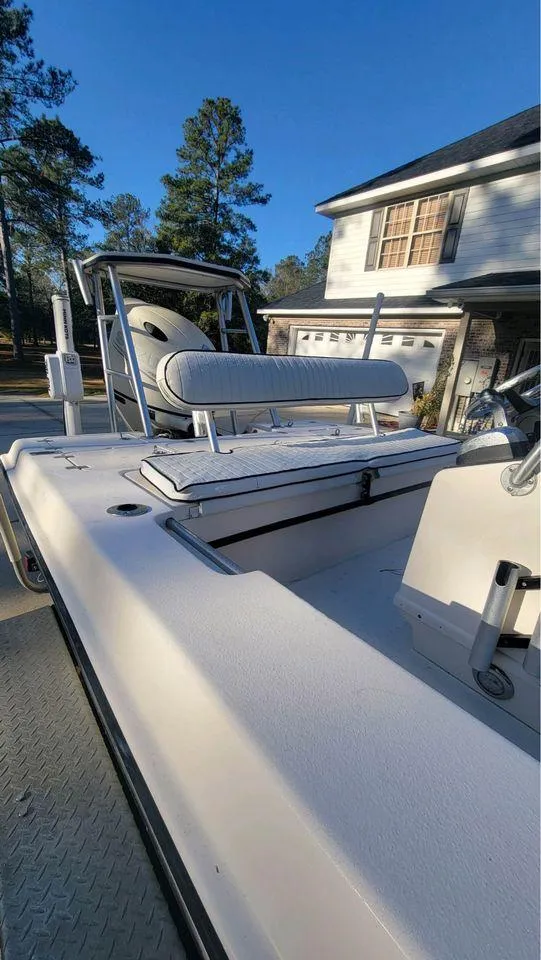Slide: The Image of 2005 Young Boats 20 in driveway, featuring sleek design and comfortable seating. - 3
