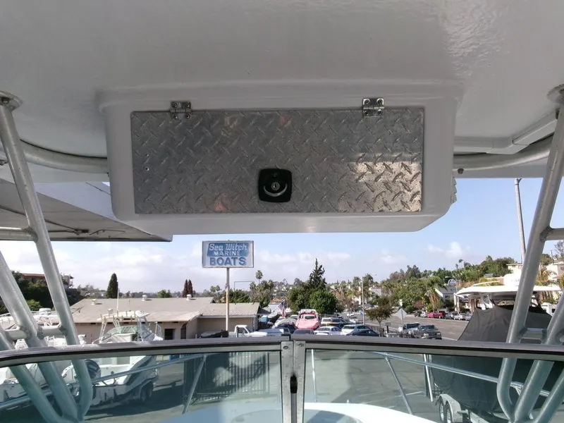 Slide: The Image of Seaswirl Striper 2600wa 1999 boat interior with metal compartment and marina view. - 14
