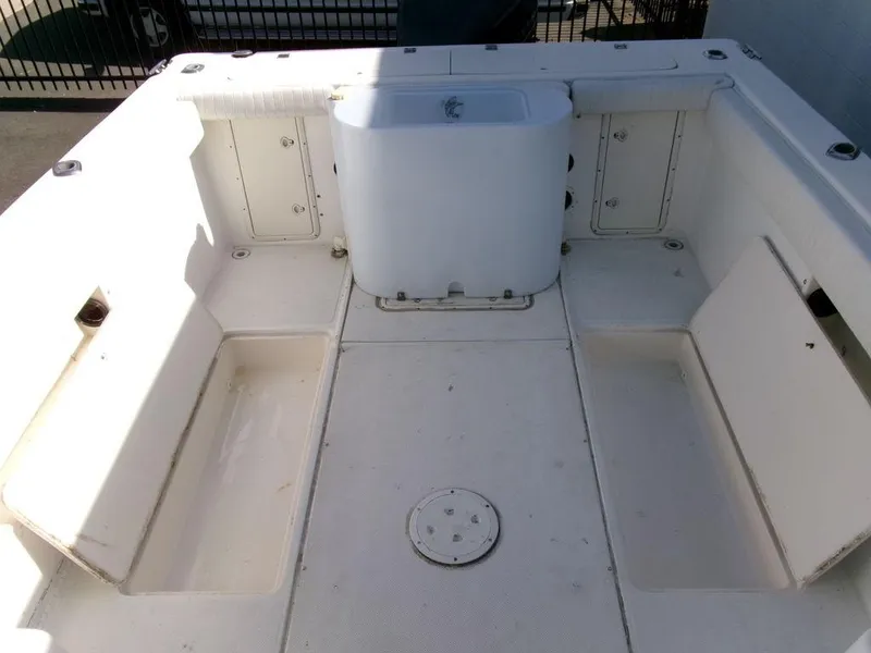 Slide: The Image of 1999 Seaswirl Striper 2600wa boat interior with spacious deck and storage compartments. - 20