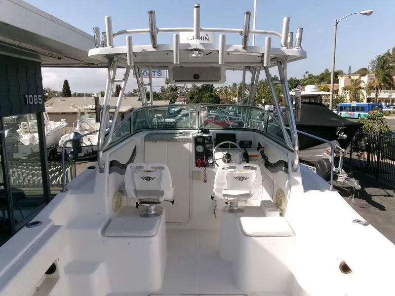 Slide: The Image of 1999 Seaswirl Striper 2600wa boat interior with helm and seating area. - 5