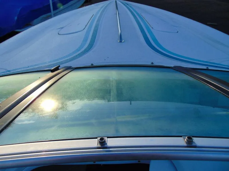 Slide: The Image of 1995 Baja 272 boat with blue stripes and windshield, viewed from above. - 12