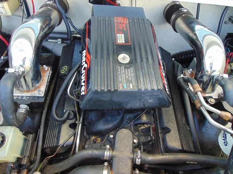 Slide: The Image of 1995 Baja 272 engine with MerCruiser components, showcasing detailed mechanical parts. - 14