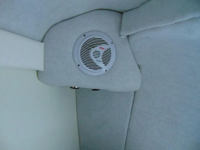 Slide: The Image of 1995 Baja 272 boat interior with speaker, gray upholstery. - 20