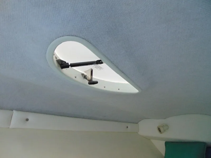 Slide: The Image of Interior view of a 1995 Baja 272 boat hatch. - 24