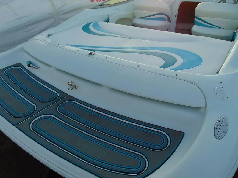 Slide: The Image of 1995 Baja 272 boat interior with blue and white seating design. - 5