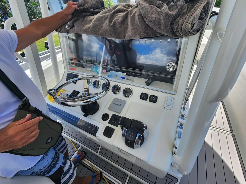 Slide: The Image of 2017 SeaVee 390Z boat console with steering wheel and controls. - 10