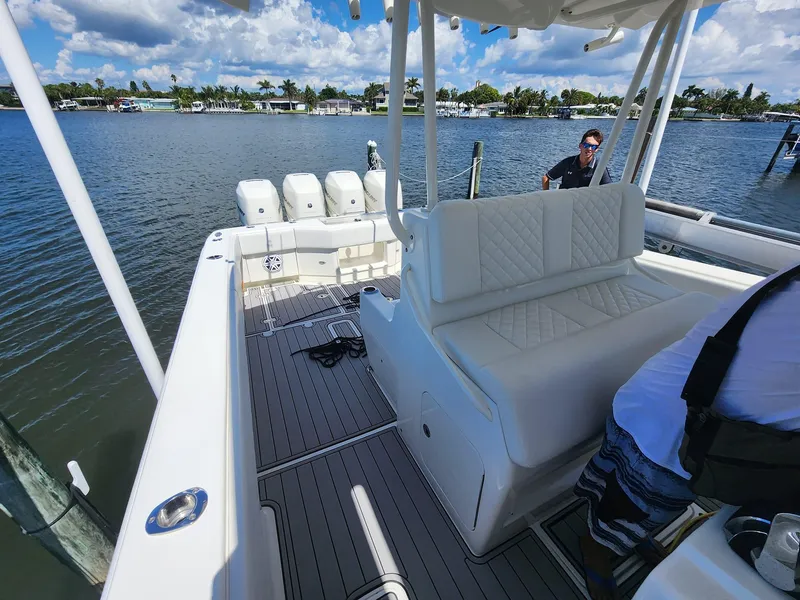 Slide: The Image of 2017 SeaVee 390Z boat with triple engines on a calm waterway. - 15