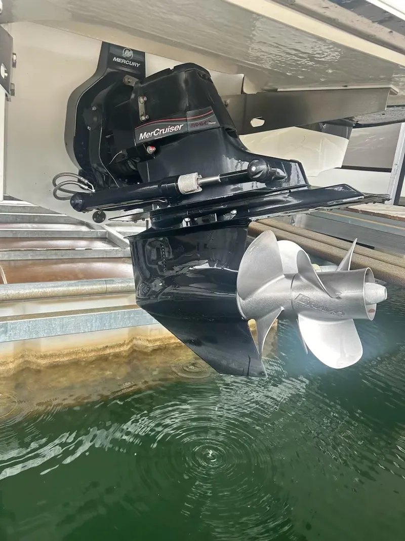 Slide: The Image of 2021 Cobalt CS23 boat with MerCruiser outdrive in water. - 18