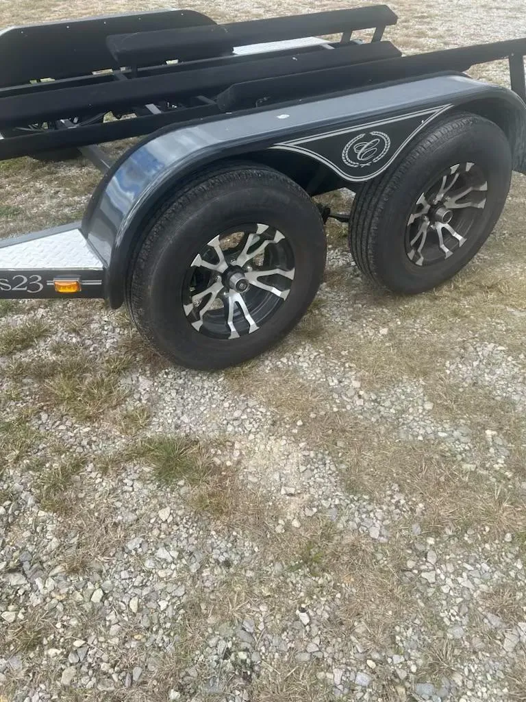 Slide: The Image of 2021 Cobalt CS23 trailer with dual wheels on gravel surface. - 5