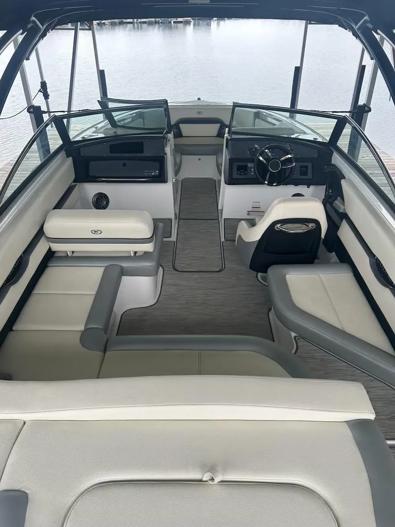 Slide: The Image of 2021 Cobalt CS23 boat interior with modern seating and steering console. - 9