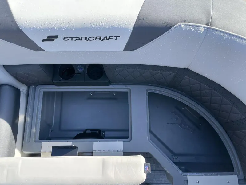 Slide: The Image of Starcraft SLS-3 2025 boat interior with storage compartment and seating area. - 13