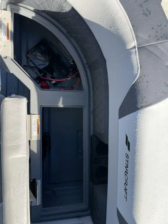 Slide: The Image of Starcraft SLS-3 2025 boat interior with storage compartment and seating. - 14