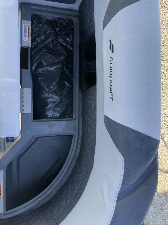 Slide: The Image of Starcraft SLS-3 boat interior, 2025 model, featuring storage compartment and seating area. - 15