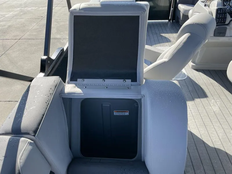 Slide: The Image of Starcraft SLS-3 2025 boat seat storage compartment open on deck. - 17