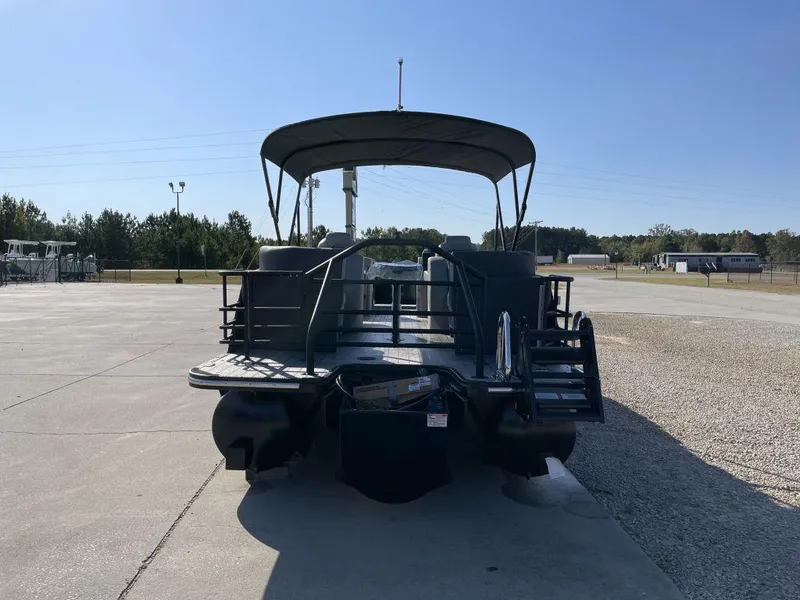 Slide: The Image of 2025 Starcraft SLS-3 pontoon boat parked outdoors on a sunny day. - 4