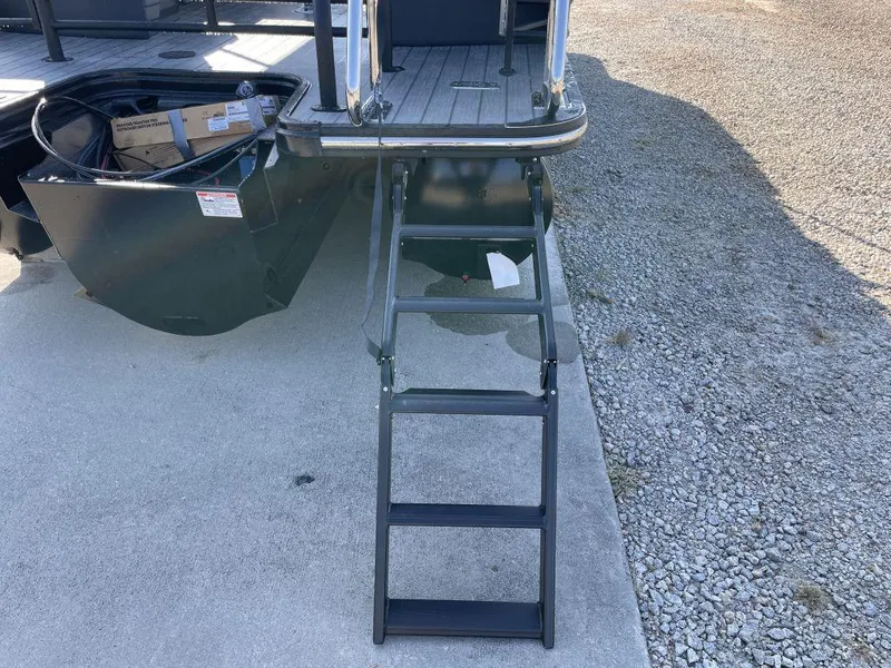 Slide: The Image of Starcraft SLS-3 2025 boat with foldable boarding ladder on concrete surface. - 5