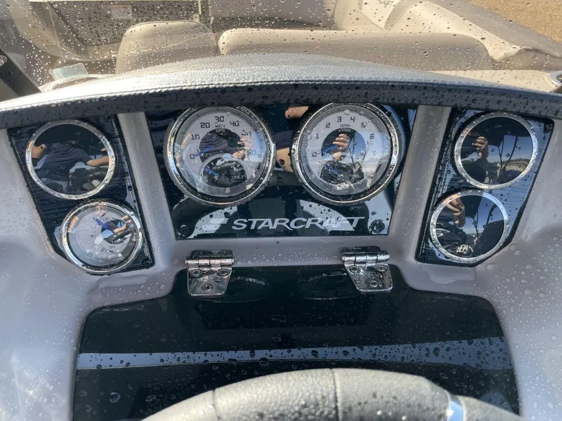 Slide: The Image of Dashboard of 2025 Starcraft SLS-3 boat with gauges and controls. - 7