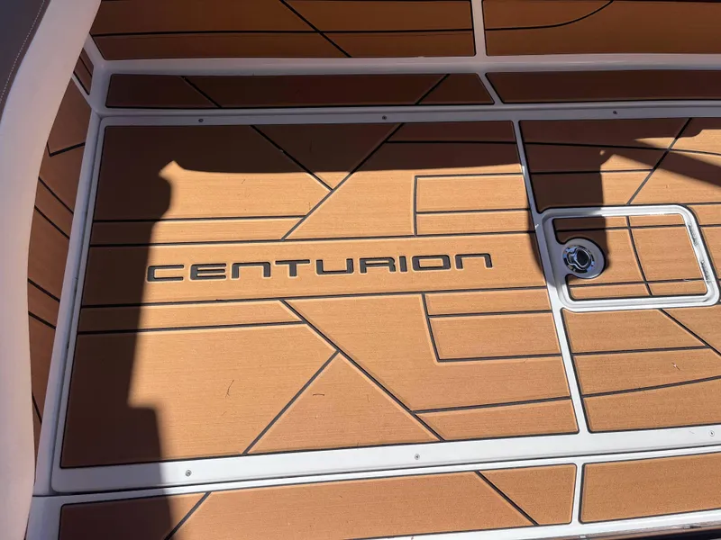 Slide: The Image of Centurion Ri245 2025 boat deck with logo and geometric design. - 10