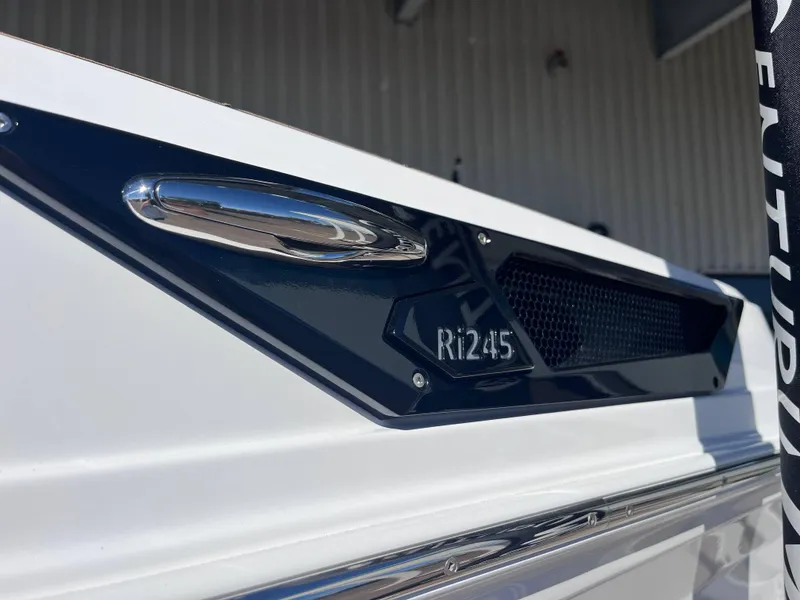 Slide: The Image of 2025 Centurion Ri245 boat detail with chrome accents and branding. - 17