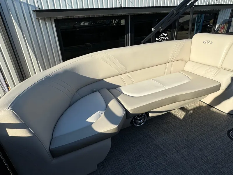Slide: The Image of Luxurious seating on 2018 Harris Solstice 240 pontoon boat, featuring beige upholstery. - 10