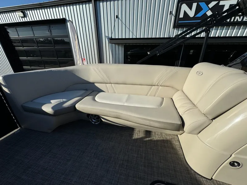 Slide: The Image of 2018 Harris Solstice 240 boat interior with beige seating and modern design. - 12