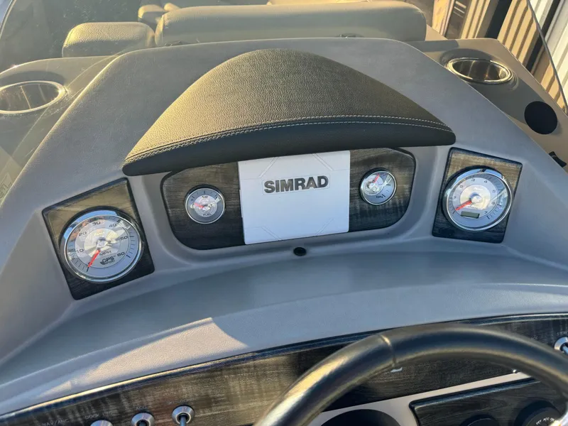 Slide: The Image of Dashboard of 2018 Harris Solstice 240 boat with Simrad display and gauges. - 16