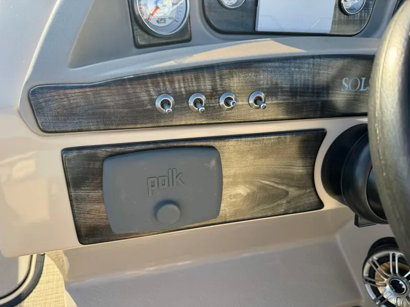 Slide: The Image of Dashboard of a 2018 Harris Solstice 240 boat with Polk audio system. - 17