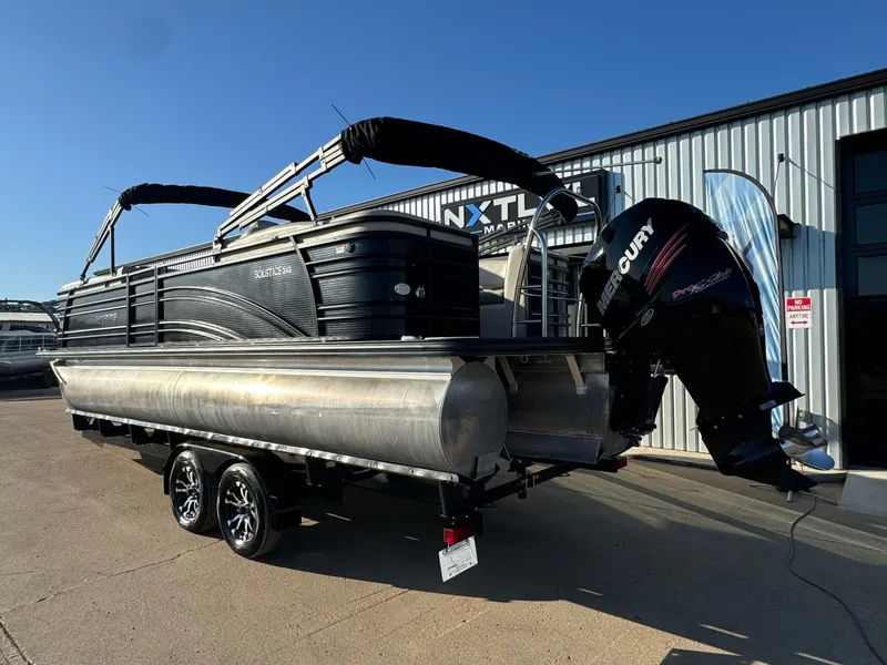 Slide: The Image of 2018 Harris Solstice 240 pontoon boat with Mercury outboard motor on trailer. - 3