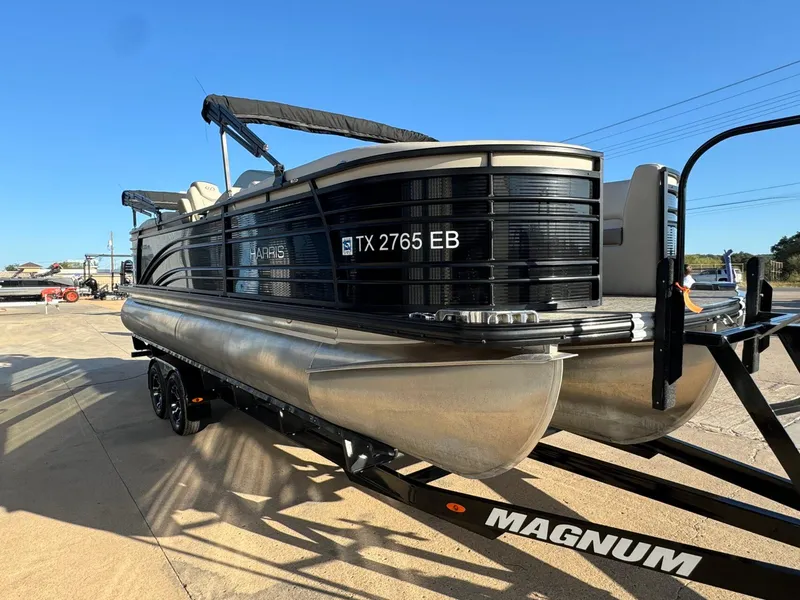 Slide: The Image of 2018 Harris Solstice 240 pontoon boat on a trailer, sunny day, side view. - 6