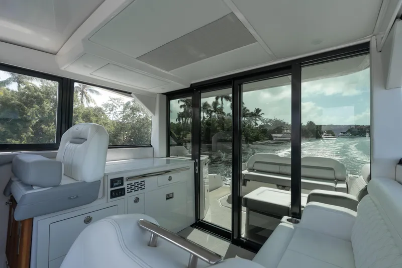 Slide: The Image of Interior of 2022 Regal 36 XO yacht with sleek design and scenic water view. - 18