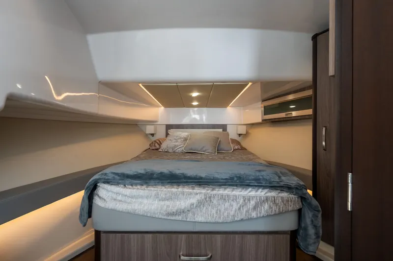 Slide: The Image of Luxurious cabin interior of 2022 Regal 36 XO yacht with cozy bedding. - 26