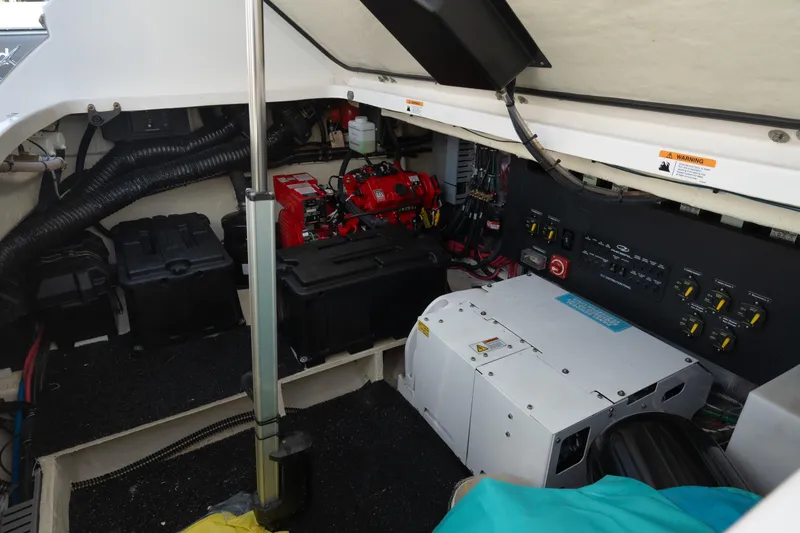 Slide: The Image of Engine compartment of 2022 Regal 36 XO boat with electrical components and wiring. - 33