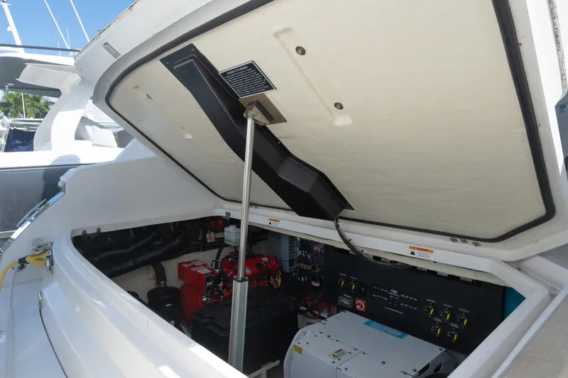 Slide: The Image of 2022 Regal 36 XO engine compartment with open hatch, showcasing internal components. - 34