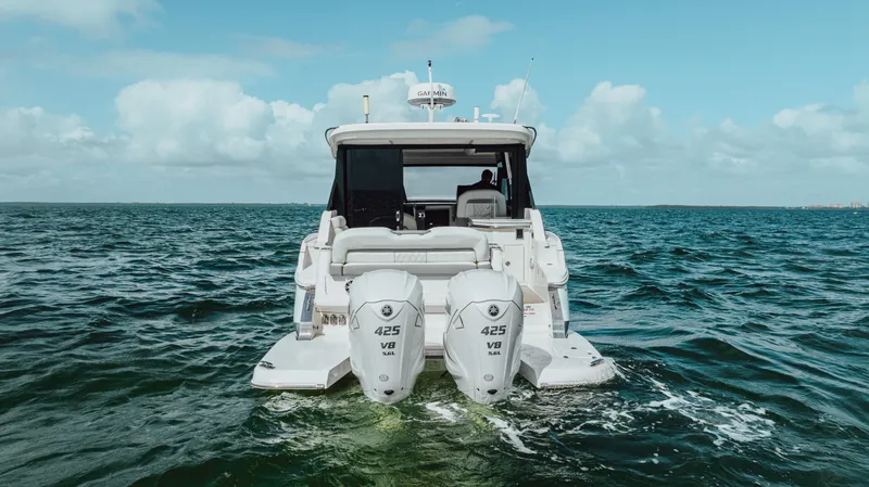 Slide: The Image of 2022 Regal 36 XO boat with twin 425 V8 engines on open water. - 8