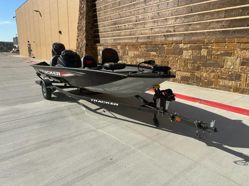 Slide: The Image of 2025 Tracker Pro Team 190 boat interior with seating and steering console. - 5