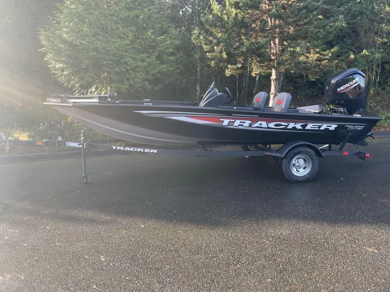 The Image of 2025 Tracker Pro Team 175 Crappie Edition boat on trailer, parked outdoors. - 0